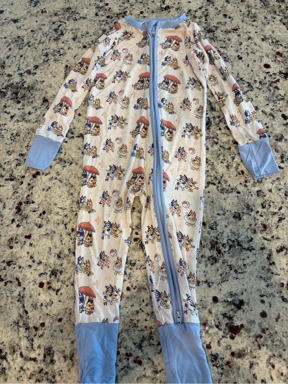 Bronx Cream Onesie Footie with Light Blue Trim and Playful Animal Print